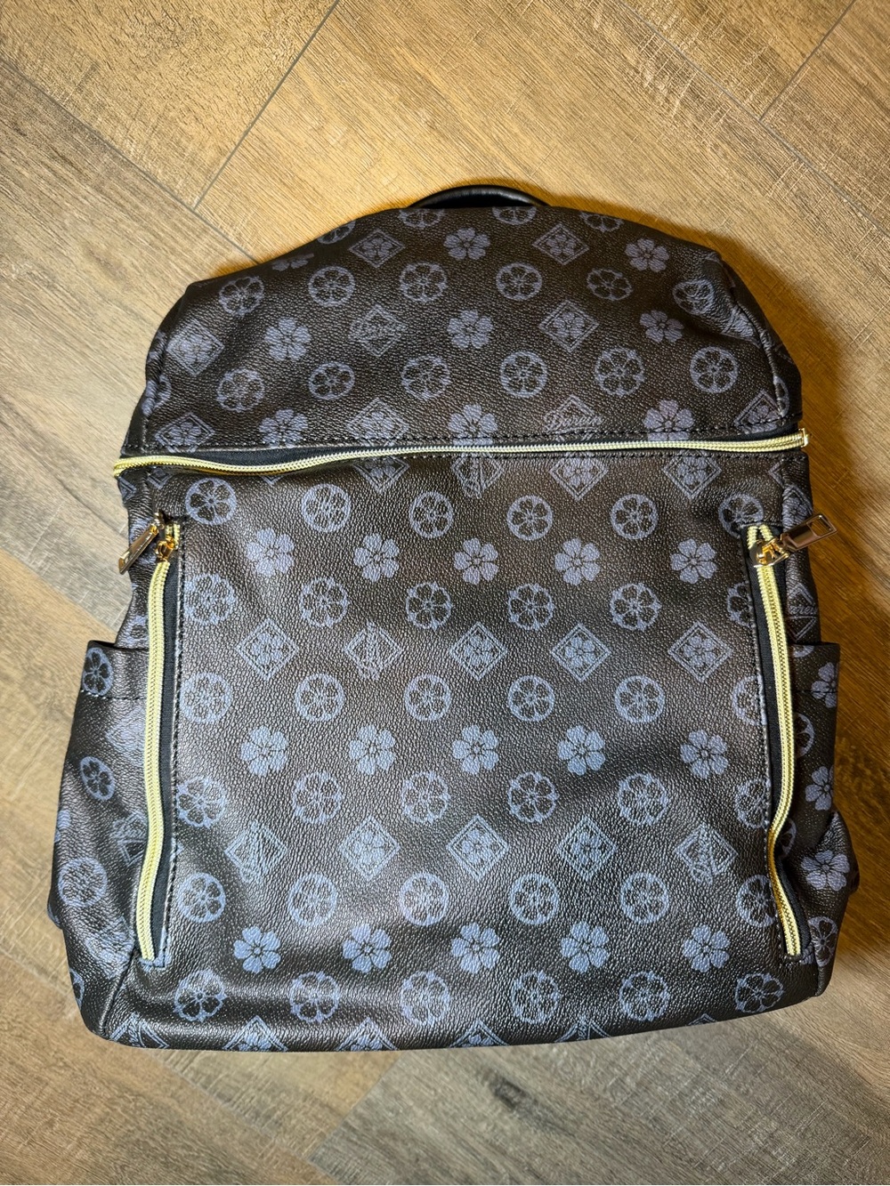NWOT Black Patterned Faux Leather Backpack with Gold Zippers